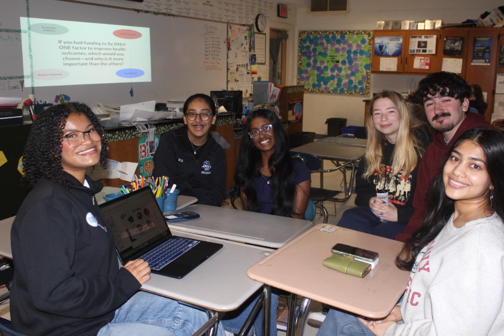 Students smiling together in a Health Decoded classroom session